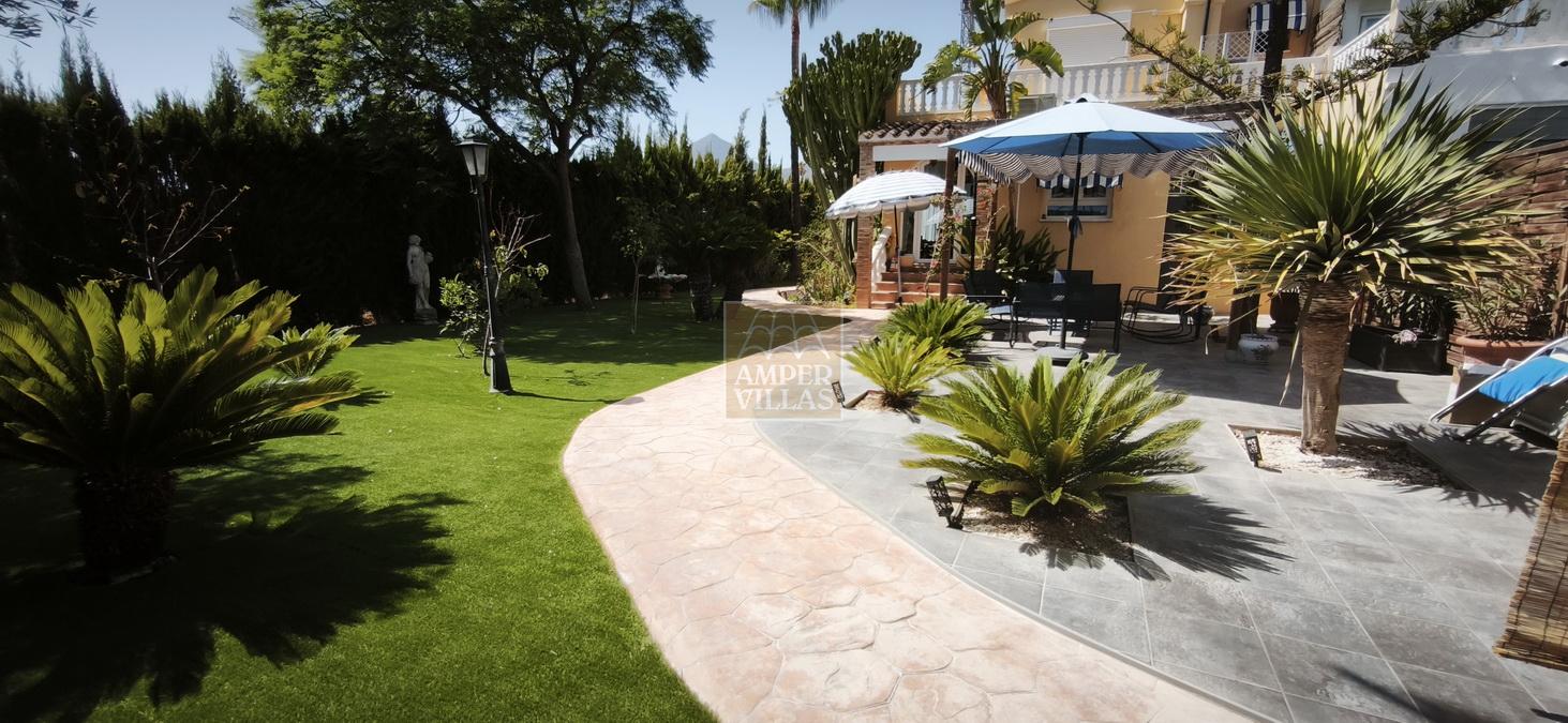 A fully renovated corner bungalow with a large garden.